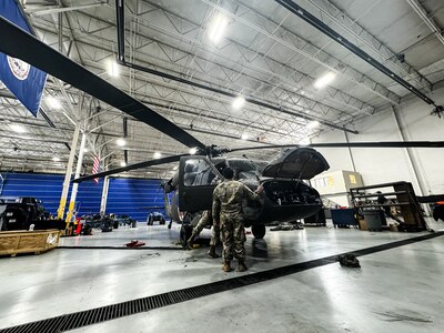 Virginia National Guard Soldiers conduct maintenance on a UH-60 Black Hawk helicopter April 2, 2024, at the Army Aviation Support Facility in Sandston, Virginia. The Soldiers are part of the AASF’s avionics shop, which troubleshoots, diagnoses and repairs avionic components and wiring on the VNG’s Black Hawk fleet. (U.S. Army National Guard photo by Sgt. 1st Class Terra C. Gatti)