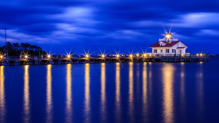 The Roanoke Marshes Lighthouse, in Manteo North Carolina, provides a guiding light into the Manteo Harbor November 11, 2017. (U.S. Coast Guard Photo by Auxiliarist Andrew Winz)