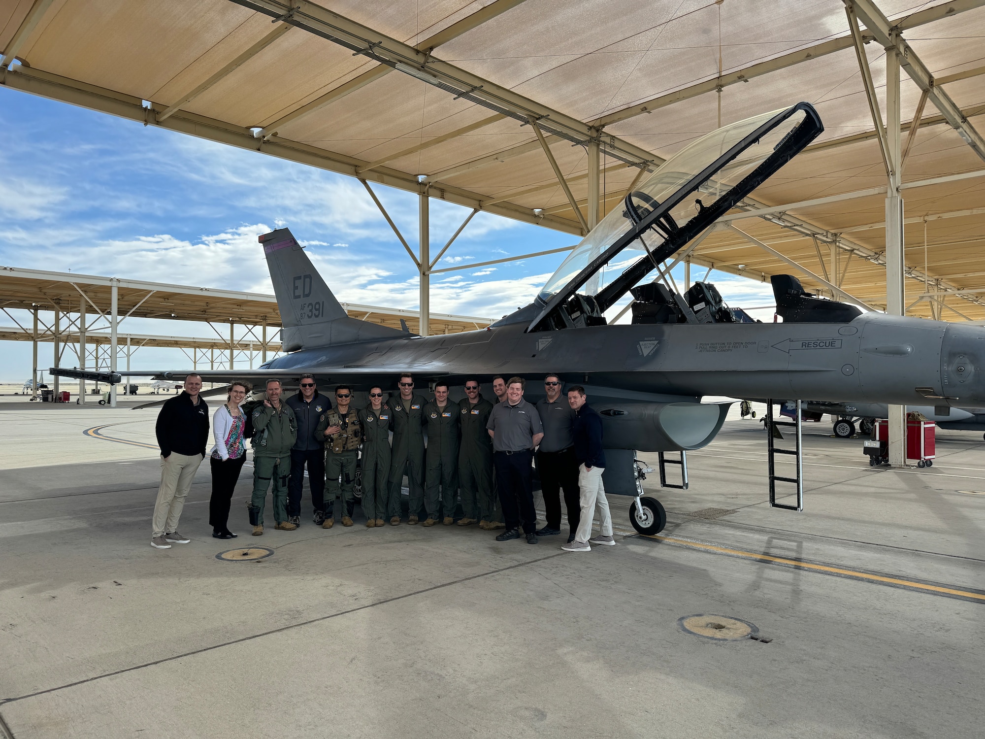 Air Force Research Laboratory, or AFRL, scientists and engineers along with U.S. Air Force Test Pilot School students prepare for the Integrated Cockpit Sensing, or ICS, system to be flight tested on an F-16 at Edwards Air Force Base, California, March 12, 2024. An AFRL team developed the ICS system to provide an airworthy platform for comprehensive physiological, life-support and environmental monitoring to improve pilot safety and performance. The system has helmet-based, base layer and life-support sensors, ensuring holistic information on the pilot and operating environment during flight. (U.S. Air Force photo / Wei Lee)