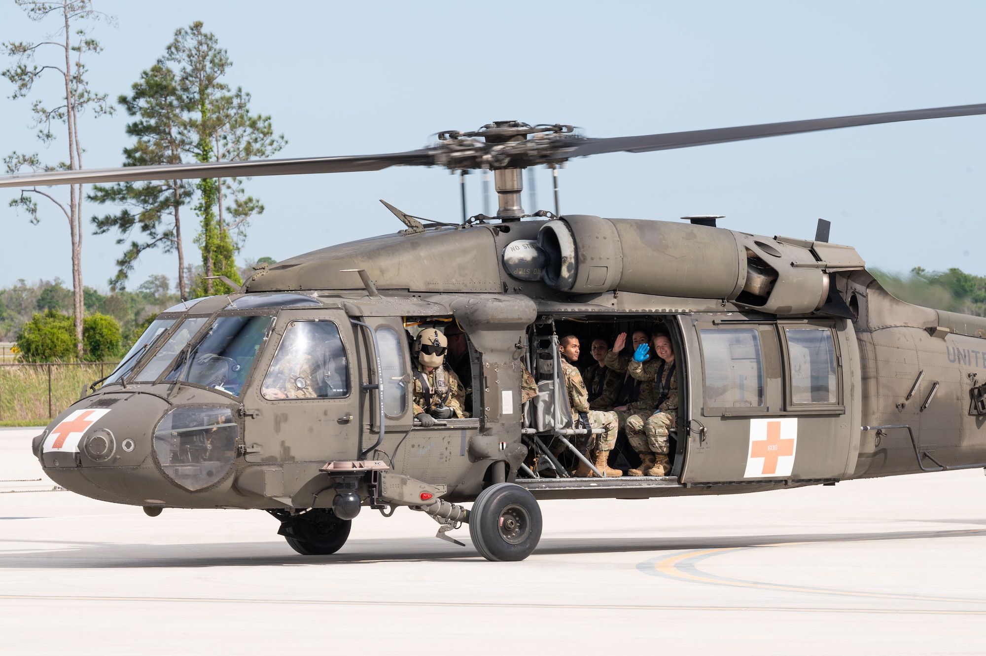 A 5th Batallion, 159th Aviation Regiment UH-60 Black Hawk helicopter crew transports 927th Aeromedical Staging Squadron Airmen on MacDill Air Force Base, Florida, April 6, 2024. The 927th ASTS partnered with the 5-159th to conduct Black Hawk and aeromedical evacuation familiarization training. (U.S. Air Force photo by Tech. Sgt. Bradley Tipton)
