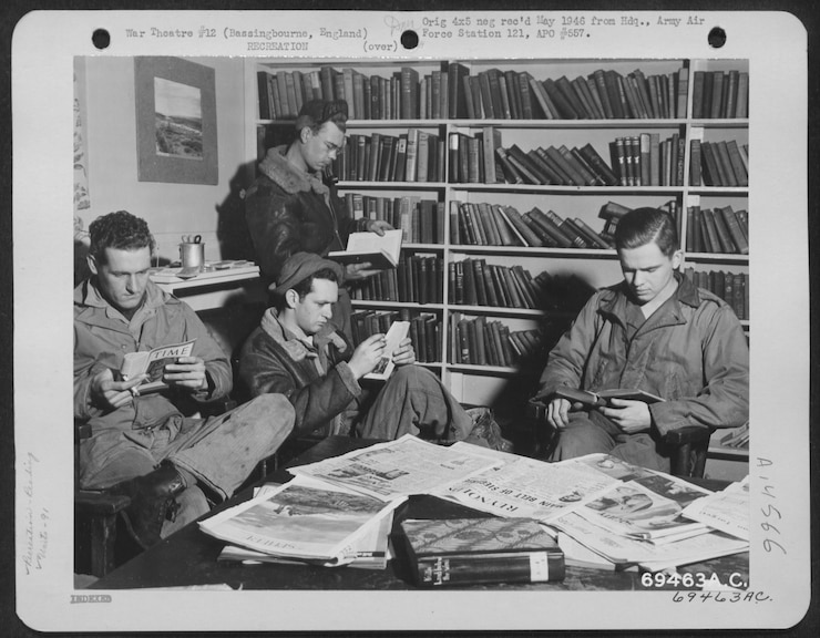 Army Air Force personnel in recreation library at Bassingbourn, England.