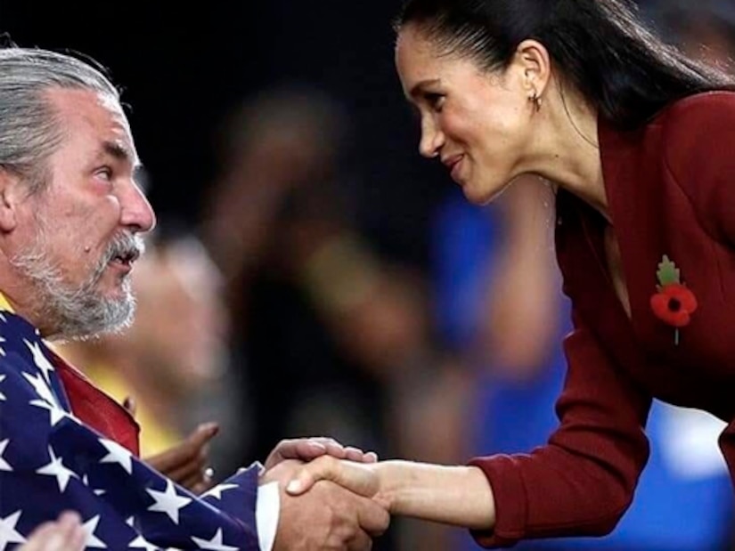 Chris Parks shaking hands with the Duchess of Sussex after his team received the Gold Medal for Wheelchair Basketball at the Invictus Games