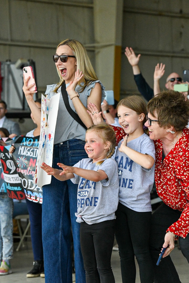 Capt. Nickolas Zappone, Higher Headquarters Company 117th Military Police Brigade, Michigan National Guard, is welcomed home by his wife, Sarah, and daughters Henly and Avery after a deployment to support Joint Task Force Guantanamo Bay in the Southern Command Area of Responsibility, Detroit, Mich., April 9, 2024.
