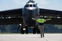 Joseph Henson, a lineman with Million Air, marshals a B-52H Stratofortress assigned to 96th Bomb Squadron, Barksdale Air Force Base, La. at Chennault International Airport, La., as part of exercise Bayou Vigilance April 12, 2024.