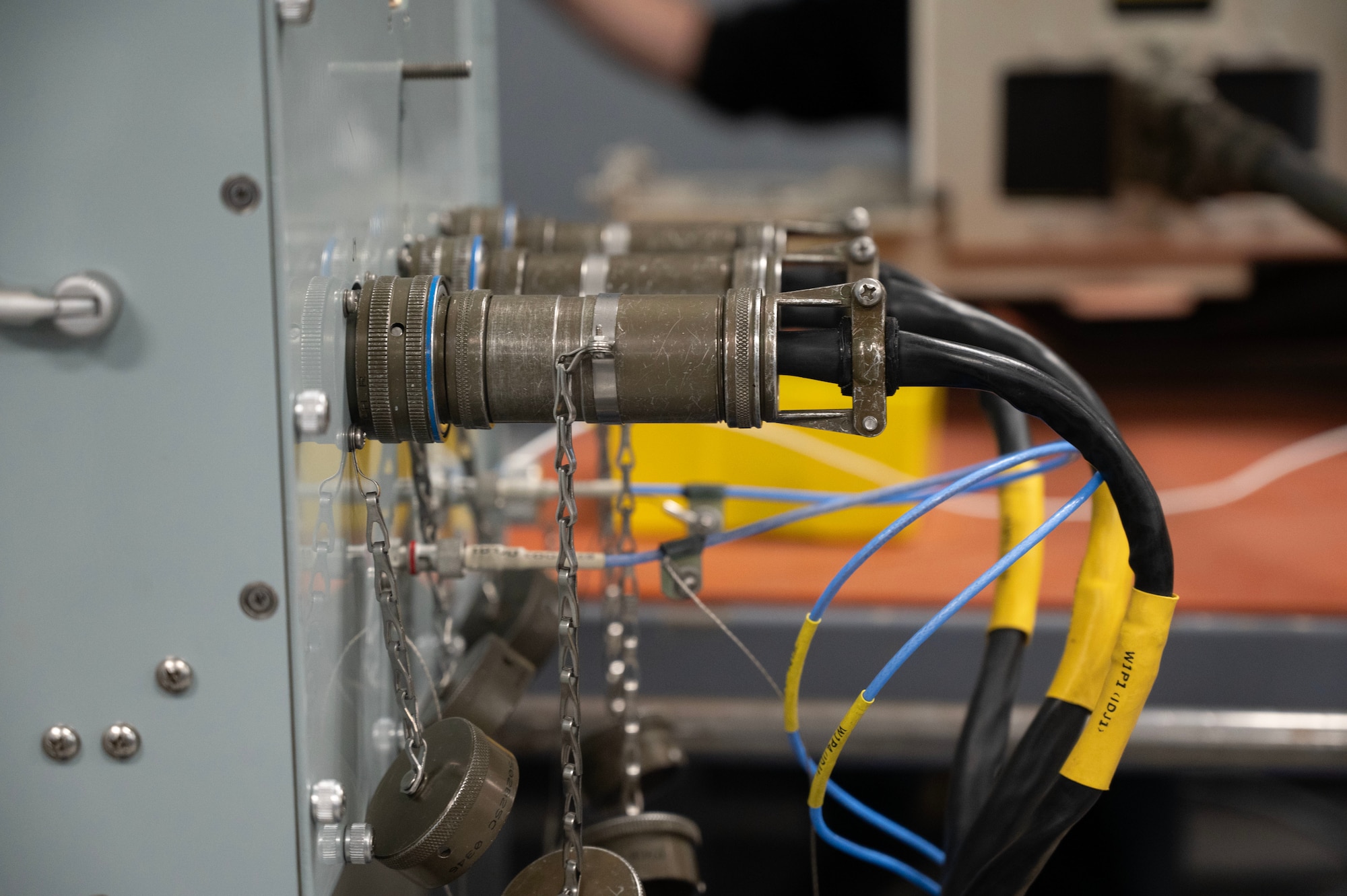 Airmen from the 62d Maintenance Squadron conduct rigorous testing to maximize the efficiency of components of the C-17 Globemaster III aircraft. By utilizing the squadron's interface test adapters, faulty electrical components are systematically diagnosed to pinpoint specific issues. These adapters, linked to computer systems, provide detailed diagnostic information to Airmen, guiding them in the precise identification and resolution of each component's malfunction. This process ensures optimal aircraft performance, vital for executing today's global airlift missions.