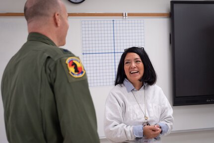 A photo of two people talking.