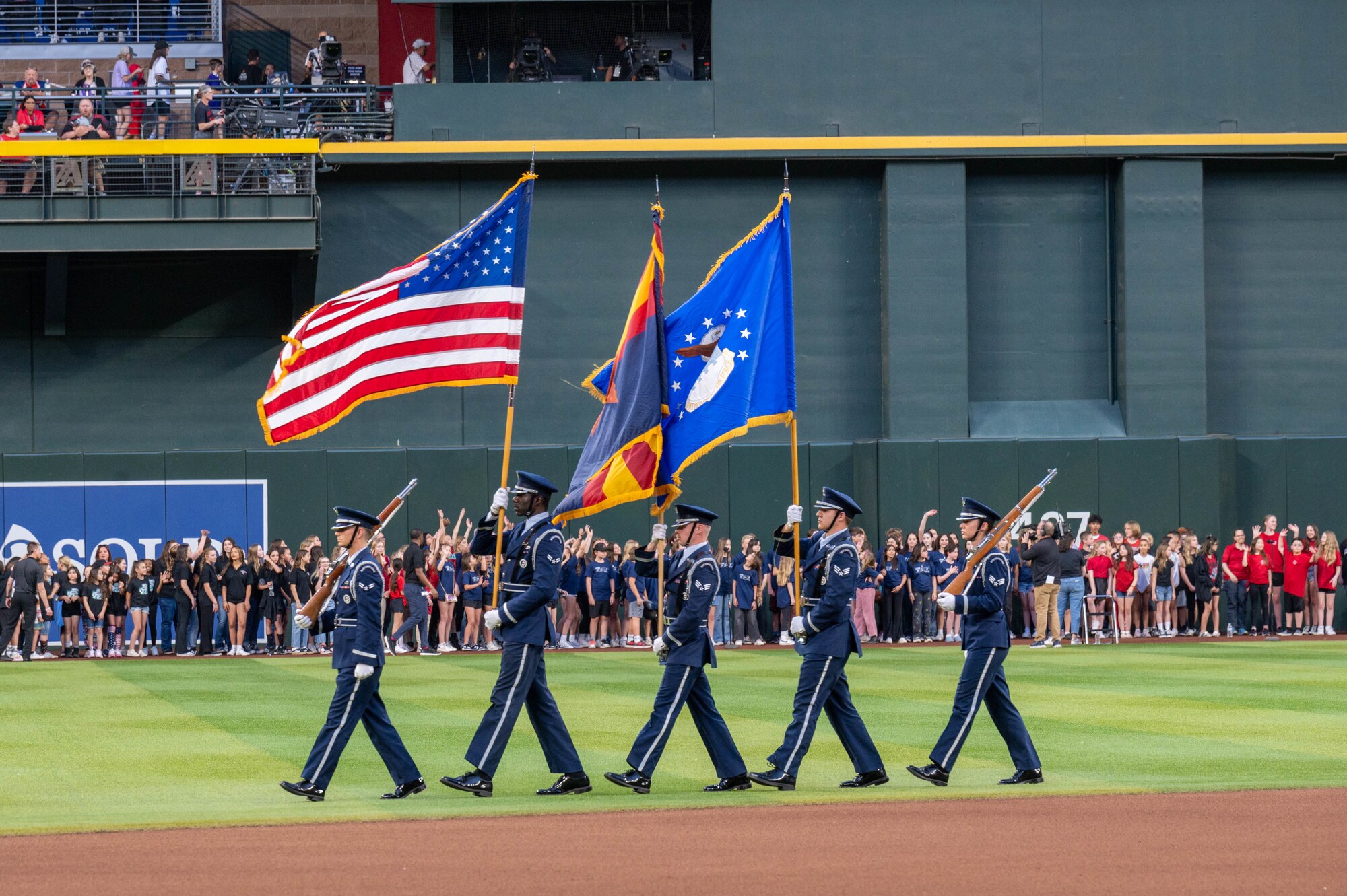 U.S. Air Force honor guardsmen assigned to the 56th Fighter Wing present the colors during a  Purple Up Arizona Diamondbacks game, April 12, 2024, in Phoenix, Arizona.