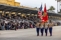 U.S. Marines with the Recruit Training Regiment Color Guard, march across the parade deck during a graduation ceremony for Mike Company, 3rd Recruit Training Battalion, at Marine Corps Recruit Depot San Diego, California, April 12, 2024. Graduation took place at the completion of the 13-week transformation, which included training for drill, marksmanship, basic combat skills, and Marine Corps customs and traditions. (U.S. Marine Corps photo by Cpl. Alexander O. Devereux)