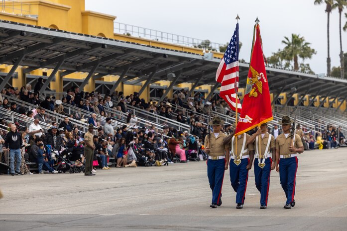 U.S. Marines with the Recruit Training Regiment Color Guard, march across the parade deck during a graduation ceremony for Mike Company, 3rd Recruit Training Battalion, at Marine Corps Recruit Depot San Diego, California, April 12, 2024. Graduation took place at the completion of the 13-week transformation, which included training for drill, marksmanship, basic combat skills, and Marine Corps customs and traditions. (U.S. Marine Corps photo by Cpl. Alexander O. Devereux)