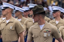 U.S. Marines from Mike Company, 3rd Recruit Training Battalion, march across the parade deck during their graduation ceremony at Marine Corps Recruit Depot San Diego, California, April 12, 2024. Graduation took place at the completion of the 13-week transformation, which included training for drill, marksmanship, basic combat skills, and Marine Corps customs and traditions. (U.S. Marine Corps photo by Cpl. Alexander O. Devereux)