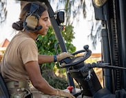 U.S. Air Force 2nd Devika Kamath, assigned to the 734th Air Mobility Squadron out of Andersen Air Force Base, Guam, operates a forklift to deliver cargo during the reception phase of site buildup during Exercise Agile Reaper 24-1 at Tinian Forward Operating Site, Northern Mariana Islands, April 8, 2024. AR 24-1 is a 3rd Wing-initiated exercise that focuses on Agile Combat Employment and employs a hub-and-spoke concept of operations with Tinian FOS serving as one of the four disaggregated spokes working under the hub situated at Andersen Air Force Base, Guam. The exercise employs combat-representative roles and processes to deliberately target all participants as a training audience and stress the force’s capability to generate combat air power in an expeditious manner across the Indo-Pacific Region. (U.S. Air Force photo by Tech. Sgt. Curt Beach)