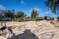 U.S. Air Force Airmen from the 3rd Air Expeditionary Wing out of Joint Base Elmendorf-Richardson, Alaska, stage cargo and supplies during site Exercise Agile Reaper 24-1 at Tinian Forward Operating Site, Northern Mariana Islands, April 8, 2024. AR 24-1 is a 3rd Wing-initiated exercise that focuses on Agile Combat Employment and employs a hub-and-spoke concept of operations with Tinian FOS serving as one of the four disaggregated spokes working under the hub situated at Andersen Air Force Base, Guam. The exercise employs combat-representative roles and processes to deliberately target all participants as a training audience and stress the force’s capability to generate combat air power in an expeditious manner across the Indo-Pacific Region. (U.S. Air Force photo by Tech. Sgt. Curt Beach)