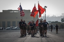 U.S. Marines with Recruit Training Regiment, lead a motivational run for Mike Company, 3rd Recruit Training Battalion, at Marine Corps Recruit Depot San Diego, California, April 11, 2024. The motivational run is the last physical training exercise Marines conduct while at MCRDSD. (U.S. Marine Corps photo by Sgt. Trey Q. Michael)