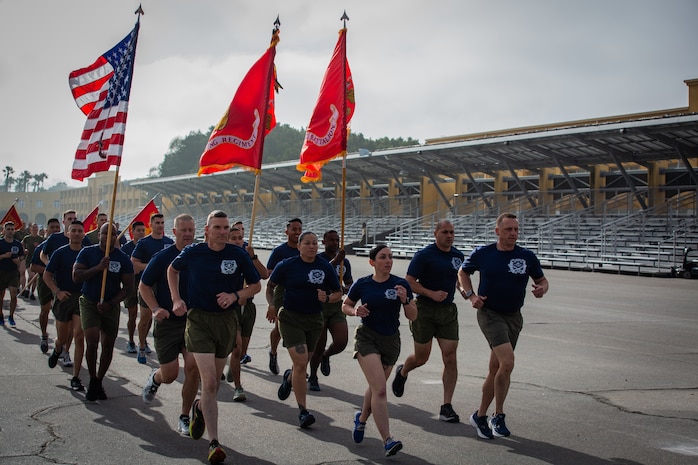 U.S. Marines with Recruit Training Regiment, lead a motivational run for Mike Company, 3rd Recruit Training Battalion, at Marine Corps Recruit Depot San Diego, California, April 11, 2024. The motivational run is the last physical training exercise Marines conduct while at MCRDSD. (U.S. Marine Corps photo by Sgt. Trey Q. Michael)