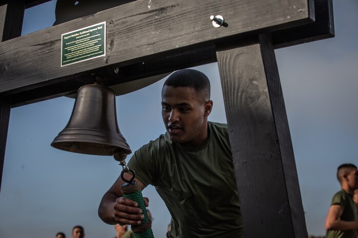 New U.S. Marines with Mike Company, 3rd Recruit Training Battalion, ring the Recruit Training Regiment bell during their motivational run at Marine Corps Recruit Depot San Diego, California, April 11, 2024. The motivational run is the last physical training exercise Marines conduct while at MCRDSD. (U.S. Marine Corps photo by Sgt. Trey Q. Michael)