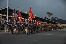 U.S. Marines with Recruit Training Regiment, lead a motivational run for Mike Company, 3rd Recruit Training Battalion, at Marine Corps Recruit Depot San Diego, California, April 11, 2024. The motivational run is the last physical training exercise Marines conduct while at MCRDSD. (U.S. Marine Corps photo by Sgt. Trey Q. Michael)