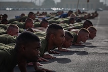 New U.S. Marines with Mike Company, 3rd Recruit Training Battalion, conduct warm-up exercises before their motivational run at Marine Corps Recruit Depot San Diego, California, April 11, 2024. The motivational run is the last physical training exercise Marines conduct while at MCRDSD. (U.S. Marine Corps photo by Sgt. Trey Q. Michael)