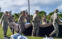 U.S. Air Force Airmen assigned to the 3rd Air Expeditionary Wing out of Joint Base Elmendorf-Richardson, Alaska, assemble an expeditionary tent during Exercise Agile Reaper 24-1 at Tinian Forward Operating Site, Northern Mariana Islands, April 9, 2024. AR 24-1 is a 3rd Wing-initiated exercise that focuses on Agile Combat Employment and employs a hub-and-spoke concept of operations with Tinian FOS serving as one of the four disaggregated spokes working under the hub situated at Andersen Air Force Base, Guam. The exercise employs combat-representative roles and processes to deliberately target all participants as a training audience and stress the force’s capability to generate combat air power in an expeditious manner across the Indo-Pacific Region. (U.S. Air Force photo by Tech. Sgt. Curt Beach)