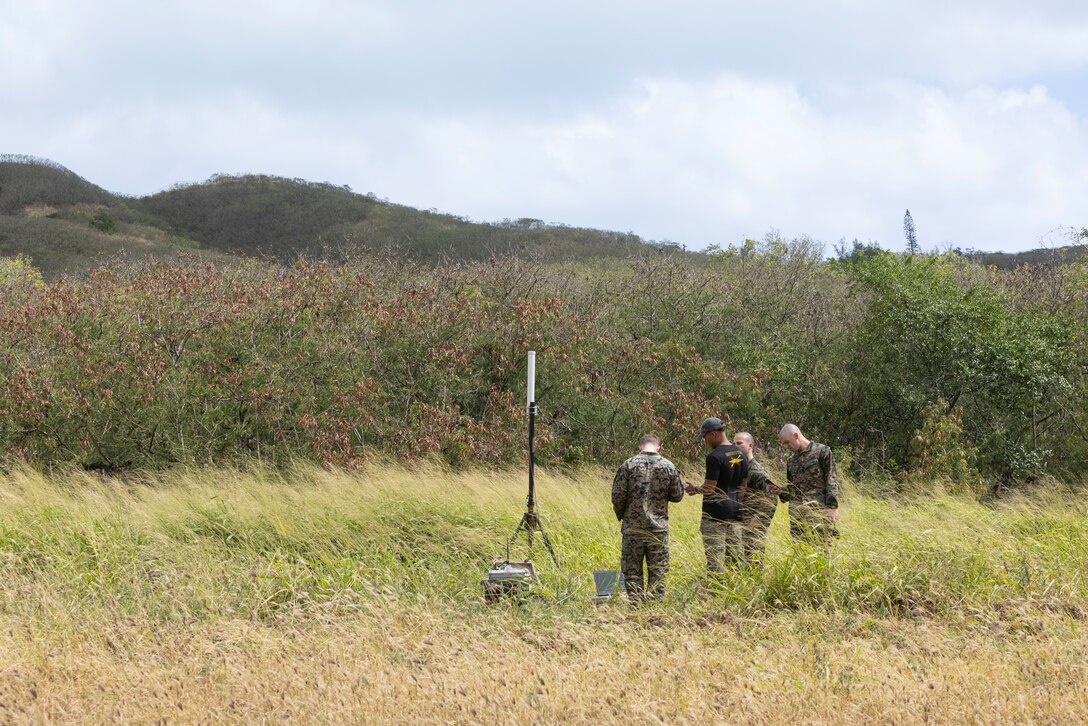 U.S. Marines 3rd Radio Battalion, III Marine Expeditionary Force Information Group, set up cellular devices in an intelligence collection operation at Bellows Air Force Station, Hawaii on April 3, 2024. The rehearsal served to test the radio reconnaissance Marines’ ability to intercept the simulated opposing force’s communication signals and collect intelligence in the preliminary phase of exercise Corvus Dawn 24 battalion operations. CD24 sharpened 3rd RADBN's ability to provide technical information related capabilities to III Marine Expeditionary Force and the joint and multi-national force throughout the Indo-Pacific region. (U.S. Marine Corps photo by Cpl. Bridgette Rodriguez)
