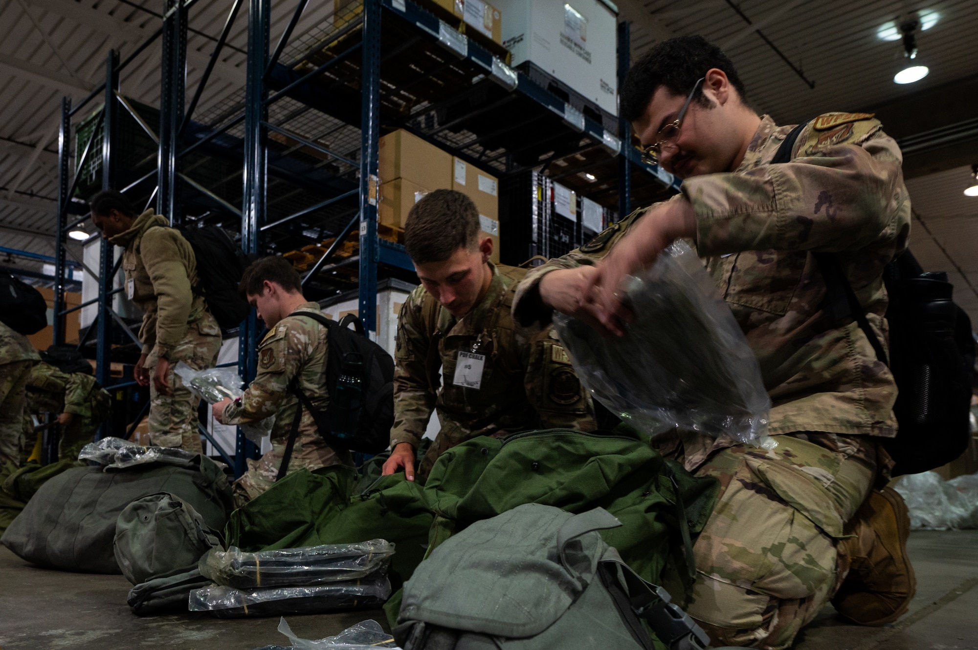 Team Hickam personnel check mobility bags.