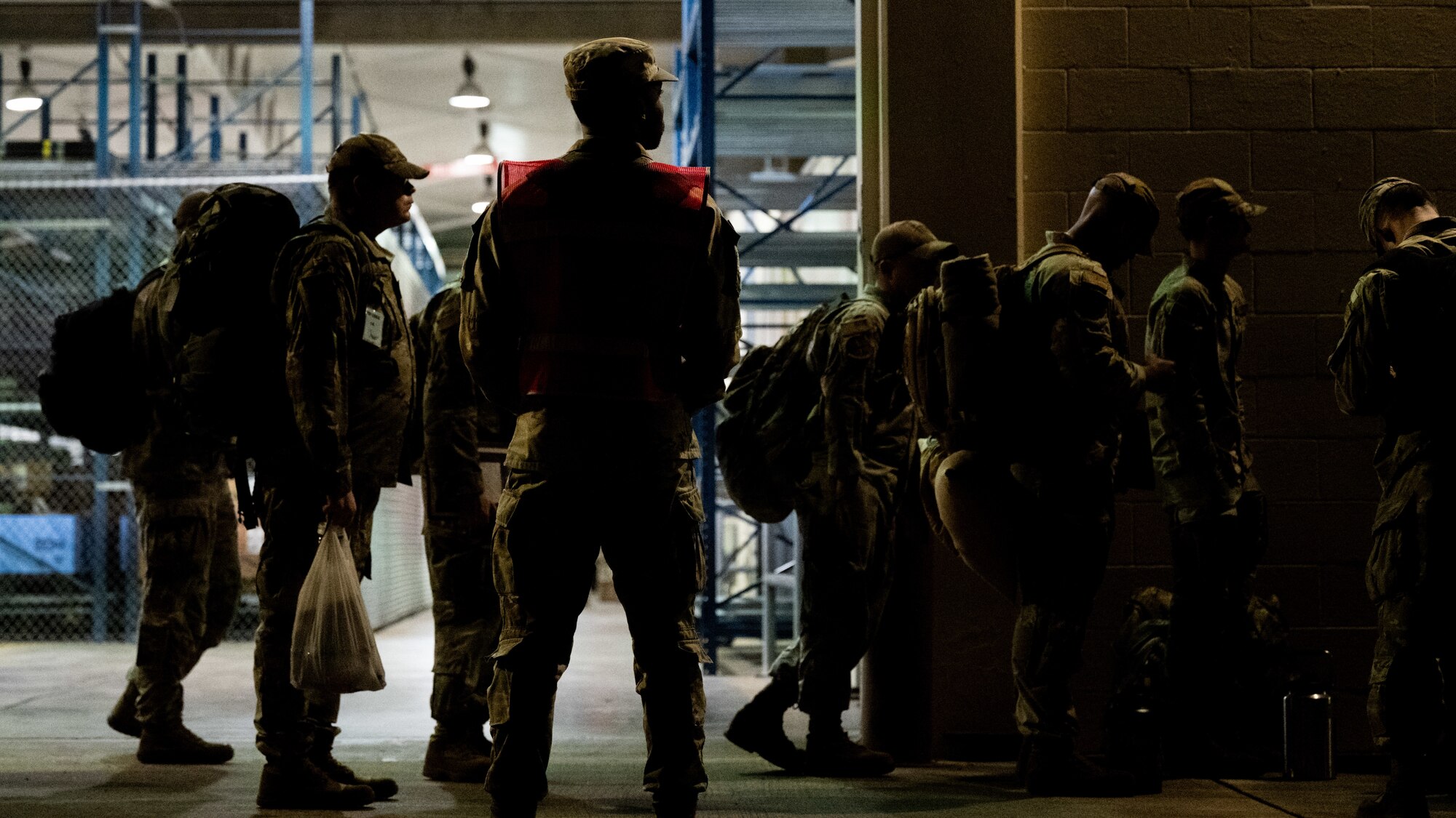 Team Hickam personnel process through a pre-deployment function line.