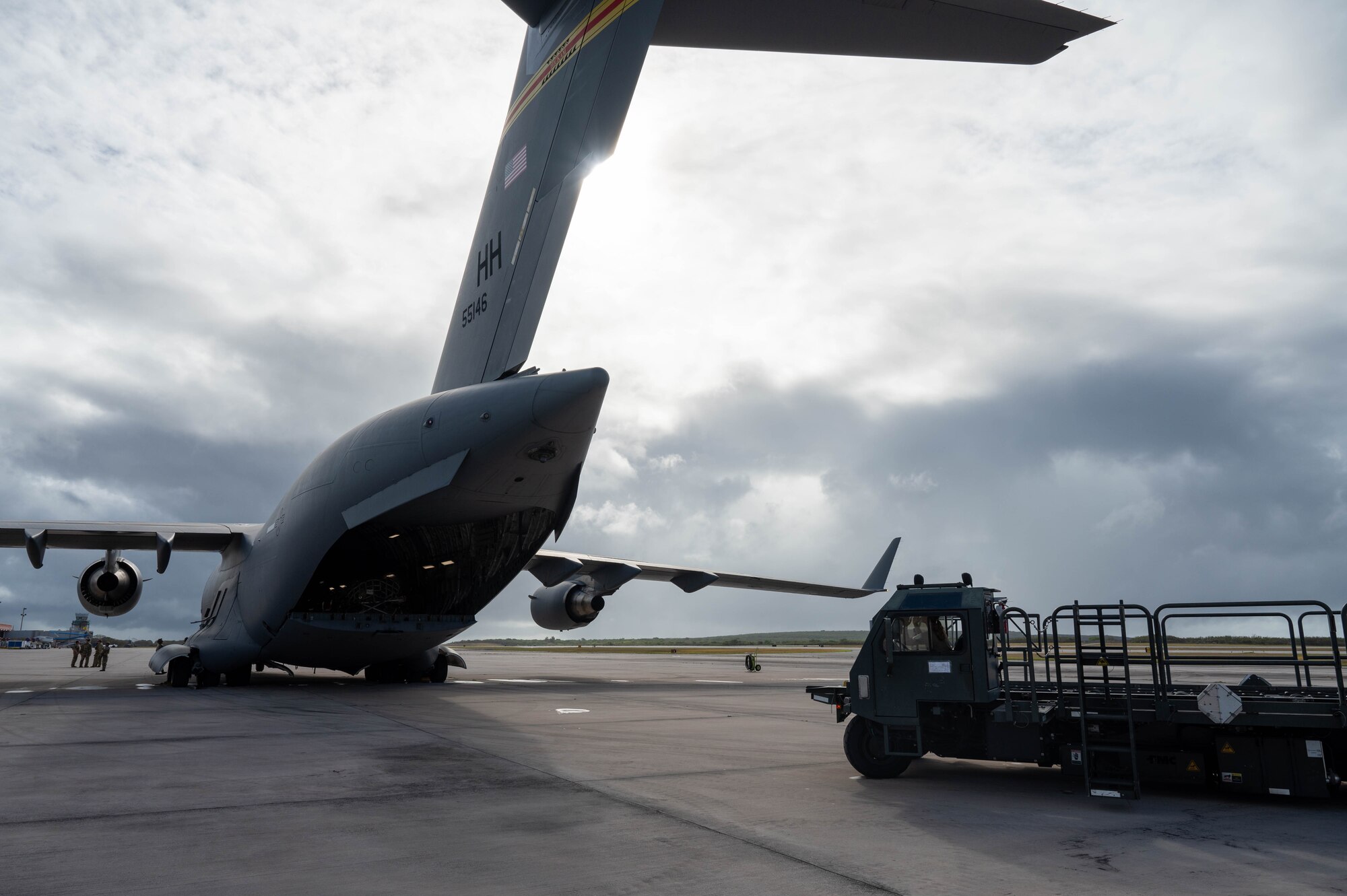 Transport equipment drives next a plane.