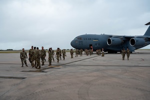 New arrivals deplane from a C-17 Globemaster III during Exercise Agile Reaper 24-1 in Saipan, North Mariana Islands, 6 April, 2024). Approximately 250 personnel from three locations traveled to participate in training within an environment where they can operate at the level of stress that will increase responsiveness to natural disasters and other challenges to better support the Pacific. (Photo by U.S. Air Force Technical Sgt. Tarelle Walker)