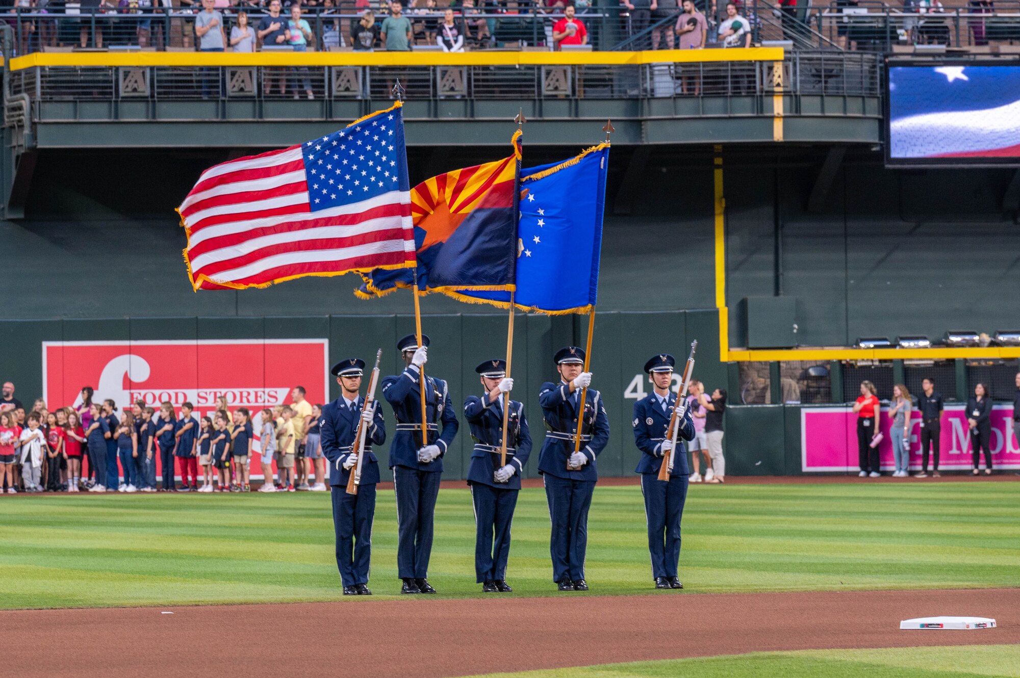 U.S. Air Force honor guardsmen assigned to the 56th Fighter Wing present the colors during a  Purple Up Arizona Diamondbacks game, April 12, 2024, in Phoenix, Arizona.