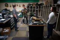 From left: Ethan Blackford, program manager and engineer, BAE Systems; Lt. Col. Joshua Arnall, director of operations, 59th Test and Evaluation Squadron; and Alexis McConnell, research biomedical engineer, Air Force Research Laboratory; discuss the Integrated Cockpit Sensing, or ICS, system prior to flight testing at Nellis Air Force Base, Nevada, Jan. 30, 2024. An Air Force Research Laboratory team developed the ICS system to provide an airworthy platform for comprehensive physiological, life-support and environmental monitoring to improve pilot safety and performance. (U.S. Air Force photo / Senior Airman Megan Estrada)