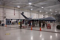Marines with VMUT-2 worked alongside civilian contractors to conduct familiarization training with VMUT-2’s first delivered and assembled MQ-9A Reaper unmanned aircraft. VMUT-2 will serve as the Marine Corps MQ-9A Reaper Fleet Replacement Squadron, whose primary mission is to train 7318 unmanned aerial systems officers and 8022 enlisted sensor operators. (U.S. Marine Corps photo by Lance Cpl. Orlanys Diaz Figueroa)