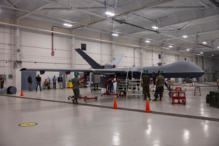 Marines with VMUT-2 worked alongside civilian contractors to conduct familiarization training with VMUT-2’s first delivered and assembled MQ-9A Reaper unmanned aircraft. VMUT-2 will serve as the Marine Corps MQ-9A Reaper Fleet Replacement Squadron, whose primary mission is to train 7318 unmanned aerial systems officers and 8022 enlisted sensor operators. (U.S. Marine Corps photo by Lance Cpl. Orlanys Diaz Figueroa)