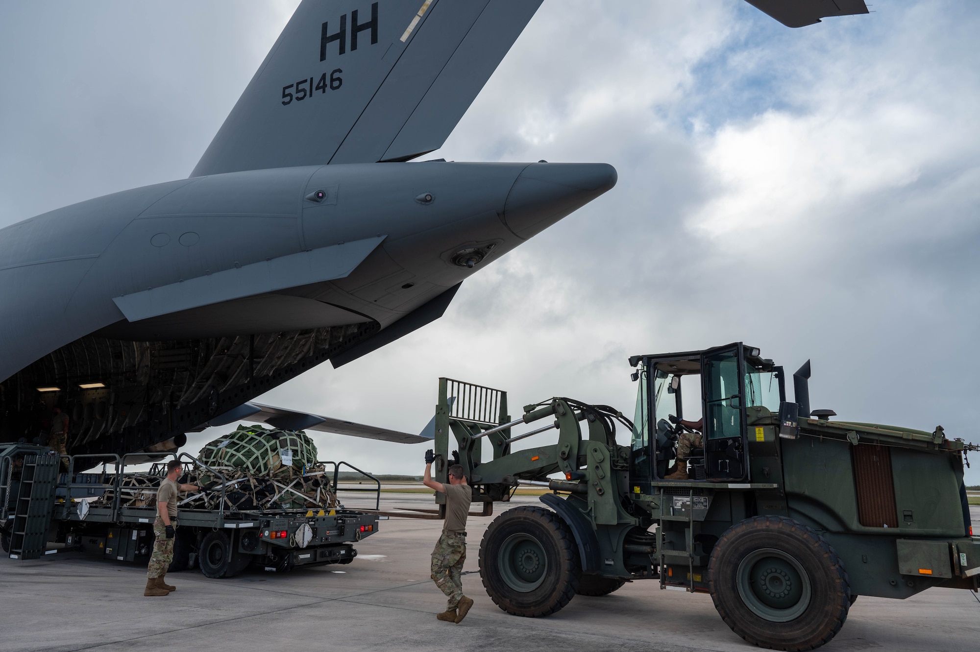The Air Transportation team with the 647th Logistics Readiness Squadron, operates a Forklift to unload cargo from the back of a C-17 Globemaster III during Exercise Agile Reaper 24-1, 6 April, 2024. Approximately 250 personnel from three locations traveled to participate in training within an environment where they can operate at the level of stress that will increase responsiveness to natural disasters and other challenges to better support the Pacific. (Photo by U.S. Air Force Technical Sgt. Tarelle Walker)