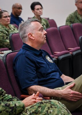 MILLINGTON, Tenn. (April 12, 2024) Rear Adm. Jim Waters, Commander, Navy Recruiting Command, listens to a briefing during the inaugural Bureau of Medicine and Surgery (BUMED) kaizen event at Navy Recruiting Command (NRC) headquarters. Kaizen is a Japanese term meaning change for the better or continuous improvement. It is a structured approach focused on identifying and eliminating roadblocks that hinder a process. This event specifically tackled challenges in recruiting qualified personnel for Navy Medicine.  (U.S. Navy photo by Mass Communication Specialist 1st Class Jose Madrigal)
