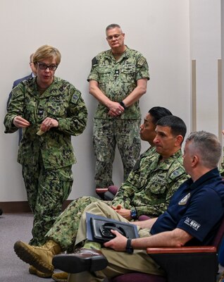 MILLINGTON, Tenn. (April 12, 2024) Capt. Teresa Allen, a native of Eighty Four, Pennsylvania, and the Medical Deputy Corps Chief for the Bureau of Medicine and Surgery (BUMED), presents to Rear Adm. Jim Waters, Commander, Navy Recruiting Command, during the inaugural kaizen event at Navy Recruiting Command (NRC) headquarters. Kaizen is a Japanese term meaning change for the better or continuous improvement. It is a structured approach focused on identifying and eliminating roadblocks that hinder a process. This event specifically tackled challenges in recruiting qualified personnel for Navy Medicine. (U.S. Navy photo by Mass Communication Specialist 1st Class Jose Madrigal)
