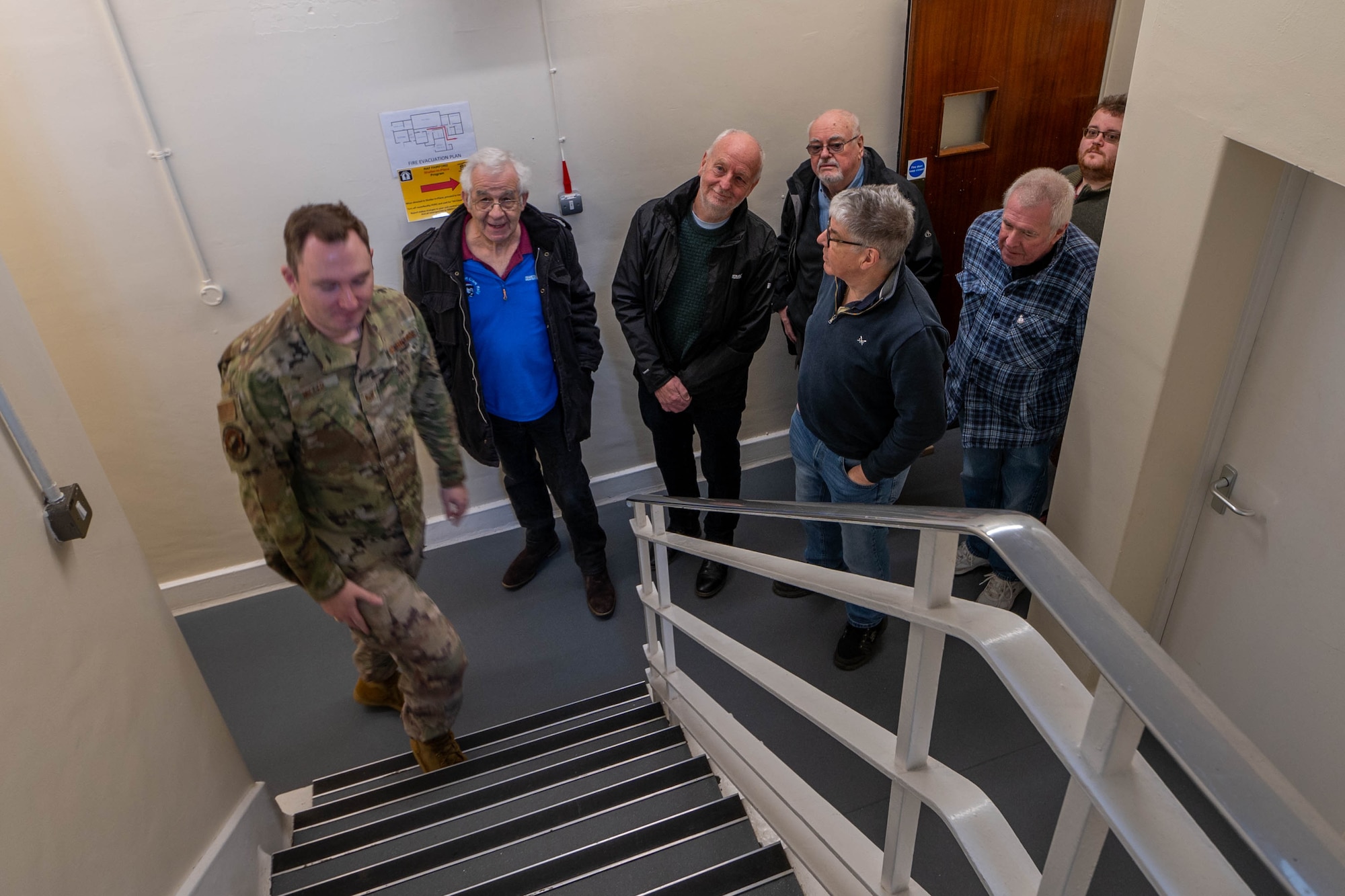 Greenham Common control tower volunteers participate in an immersion tour of the air traffic control tower.