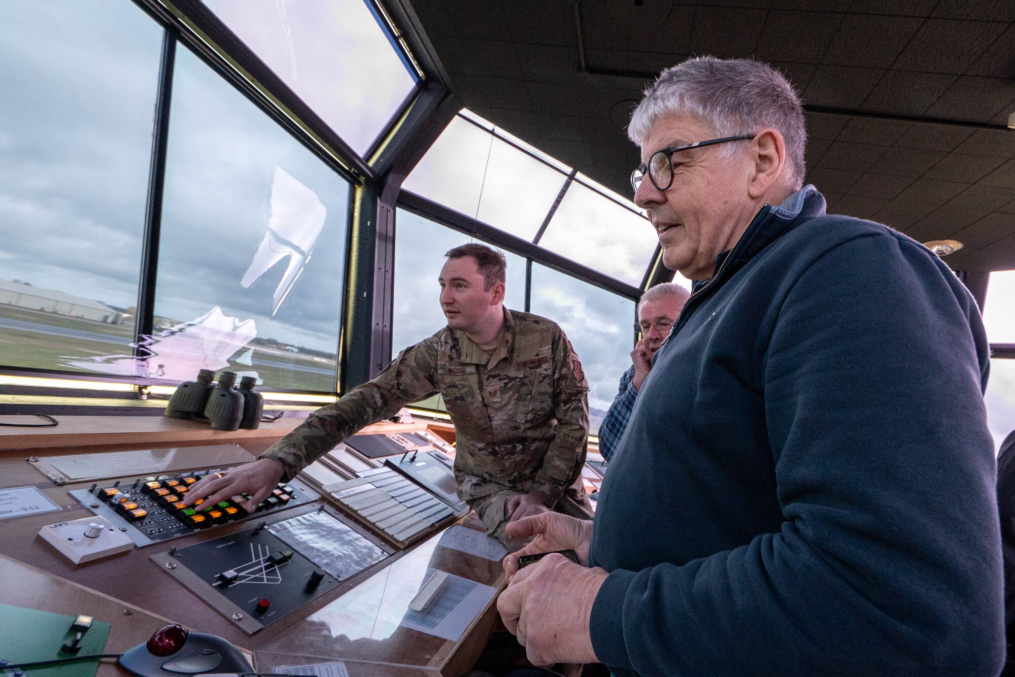 Greenham Common control tower volunteers participate in an immersion tour of the air traffic control tower.