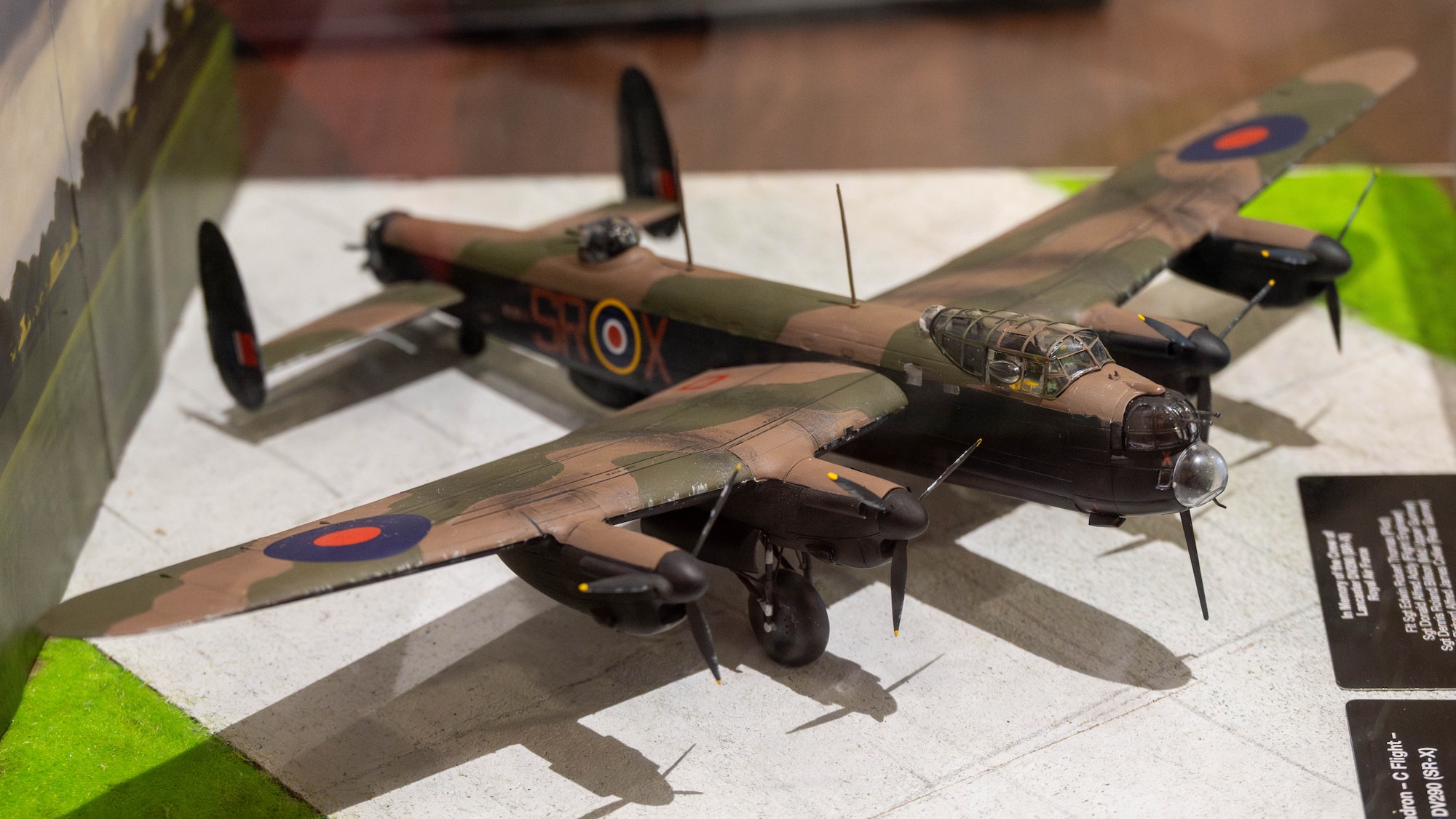 A model Lancaster DV290 is displayed after a memorial service.