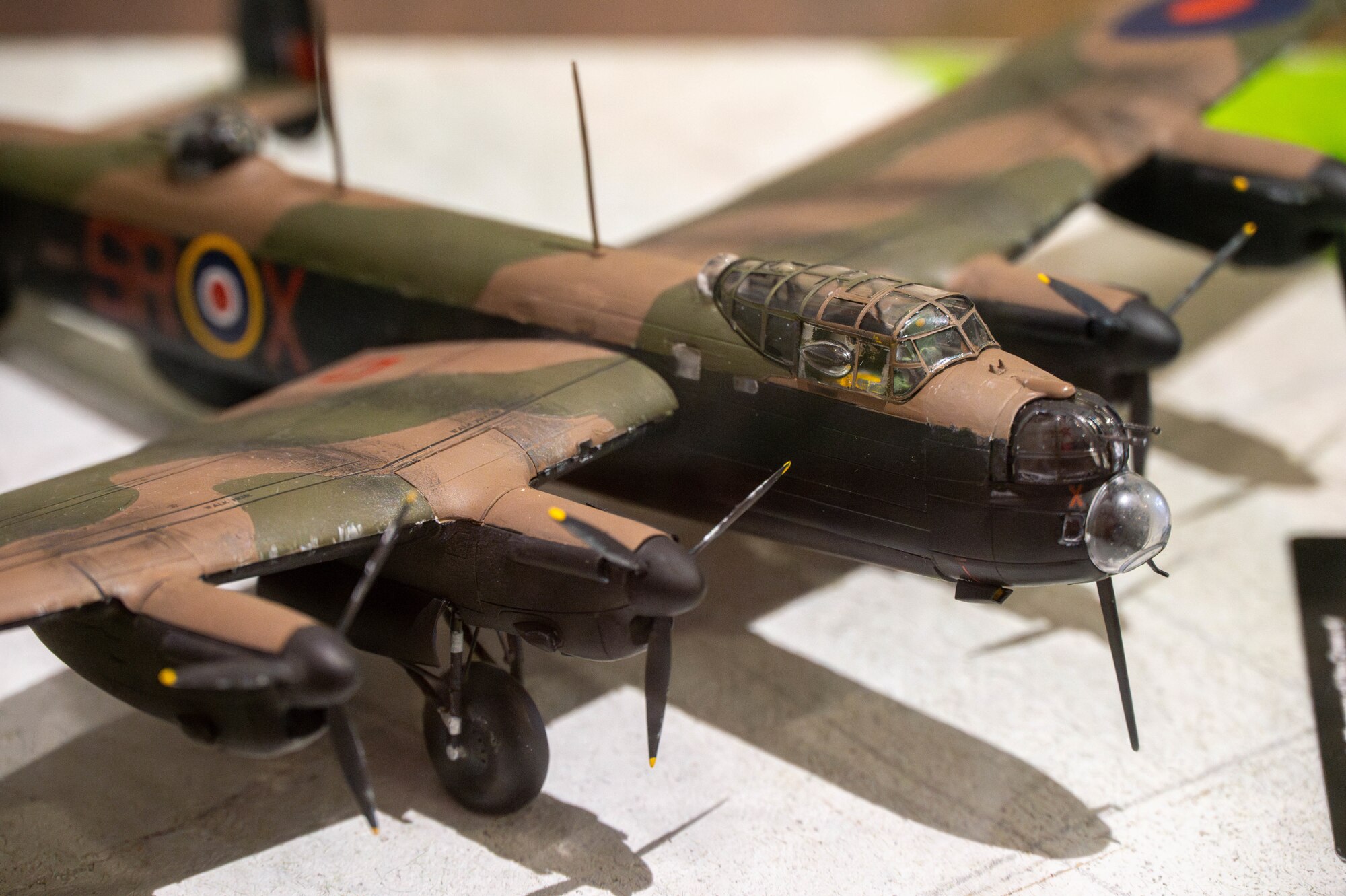 A model Lancaster DV290 is displayed after a memorial service.