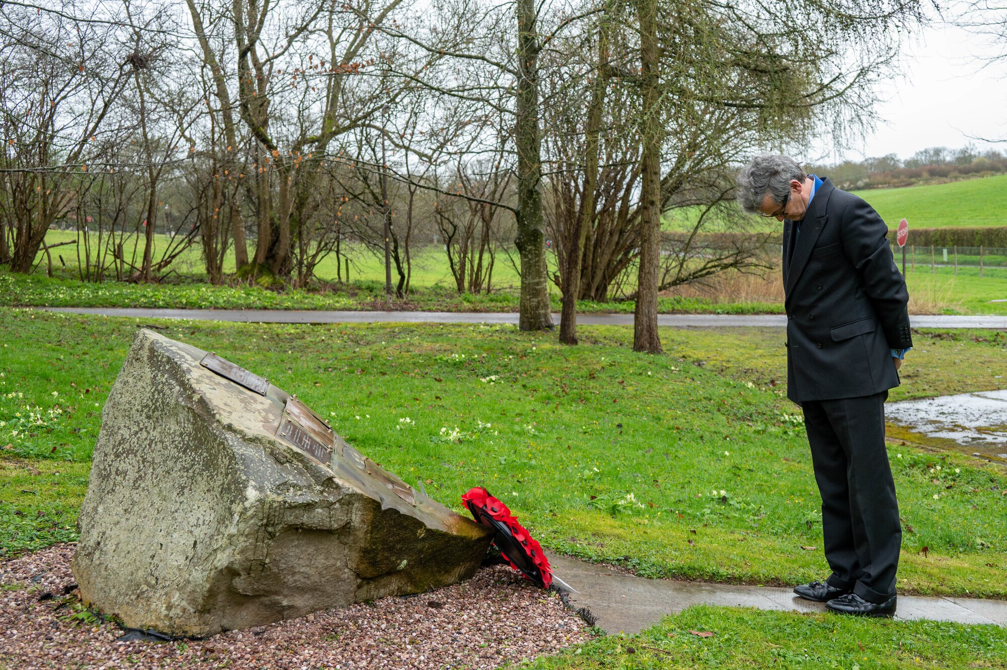 Simon Muir, High Sheriff of the Royal County of Berkshire, bows his head after a memorial service at RAF Welford.