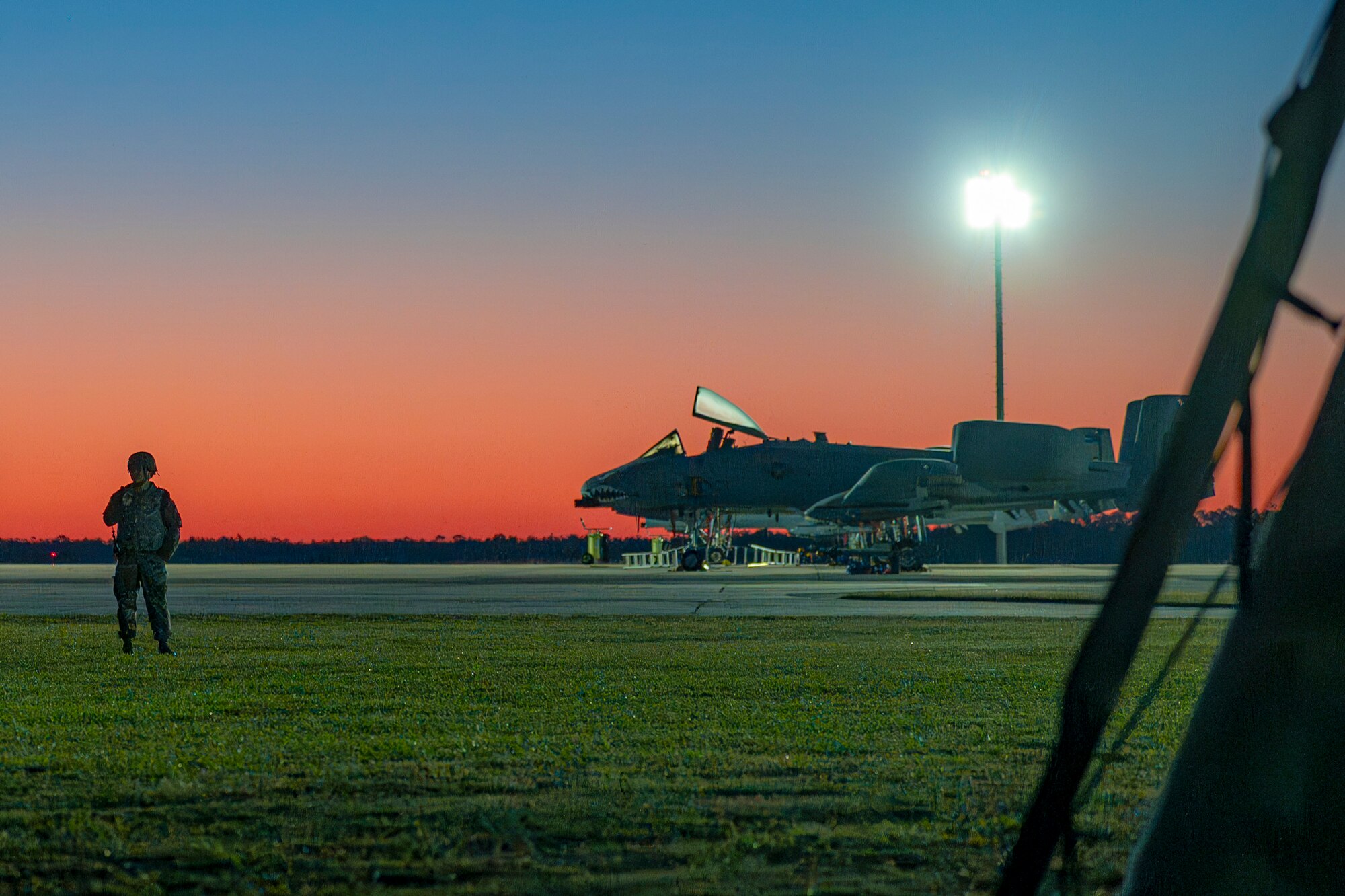 A U.S. Air Force Airman assigned to the 23rd Wing stands watch during Exercise Ready Tiger 24-1 at Avon Park Air Force Range, Florida, April 11, 2024. Airmen responded to an attack on the contingency location dealing with intruders and simulated air strikes. Built upon Air Combat Command's directive to assert air power in contested environments, Exercise Ready Tiger 24-1 aims to test and enhance the 23rd Wing’s proficiency in executing Lead Wing and Expeditionary Air Base concepts through Agile Combat Employment and command and control operations. (U.S. Air Force photo by Airman 1st Class Leonid Soubbotine)