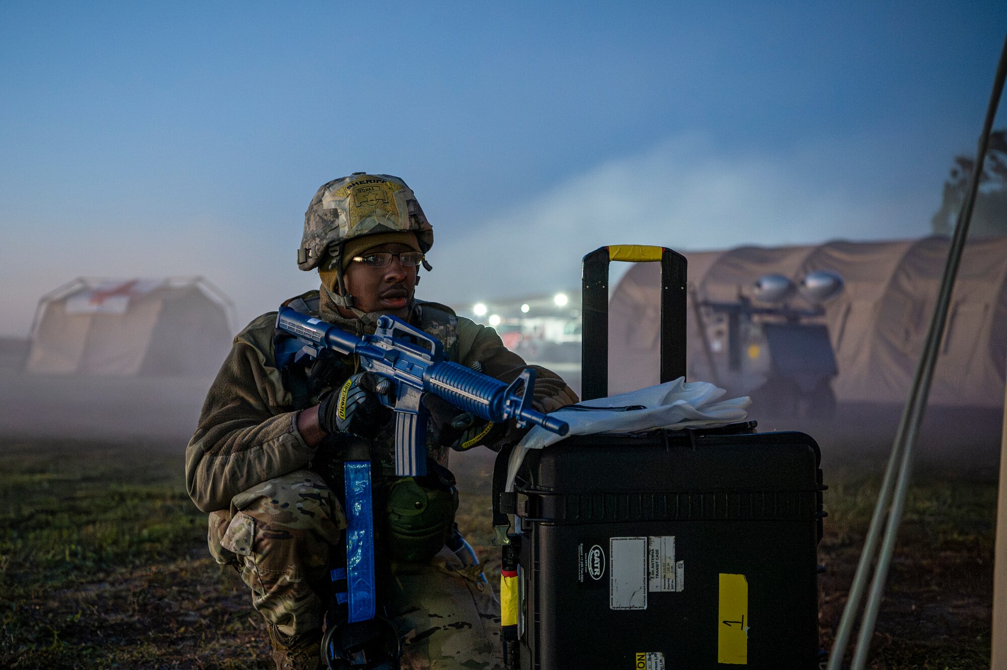 A U.S. Air Force Airman assigned to the 23rd Wing stands guard during Exercise Ready Tiger 24-1 at Avon Park Air Force Range, Florida, April 14, 2024. Exercise participants responded to a multi-prong ground attack in the early hours of the morning. Ready Tiger 24-1 is a readiness exercise demonstrating the 23rd Wing’s ability to plan, prepare and execute operations and maintenance to project air power in contested and dispersed locations, defending the United States’ interests and allies. (U.S. Air Force photo by Airman 1st Class Leonid Soubbotine)