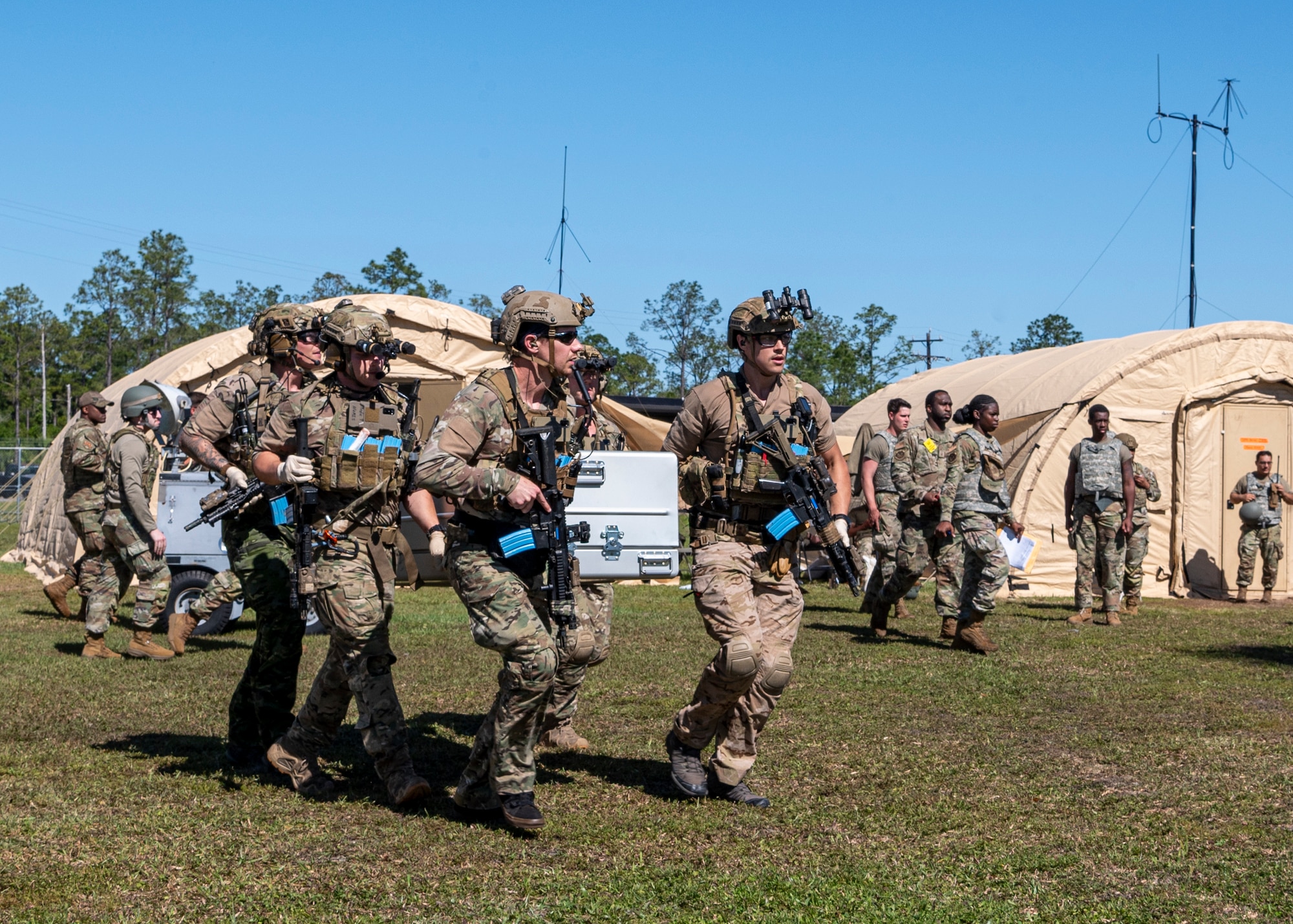U.S. Air Force Airmen assigned to the 38th Rescue Squadron carry a casket during a simulated mass casualty exercise during Exercise Ready Tiger 24-1 at Avon Park Air Force Range, Florida, April 14, 2024. Pararescuemen were able to evacuate the simulated wounded and casualties in a short amount of time. Built upon Air Combat Command's directive to assert air power in contested environments, Exercise Ready Tiger 24-1 aims to test and enhance the 23rd Wing’s proficiency in executing Lead Wing and Expeditionary Air Base concepts through Agile Combat Employment and command and control operations. (U.S. Air Force photo by Airman 1st Class Leonid Soubbotine)
