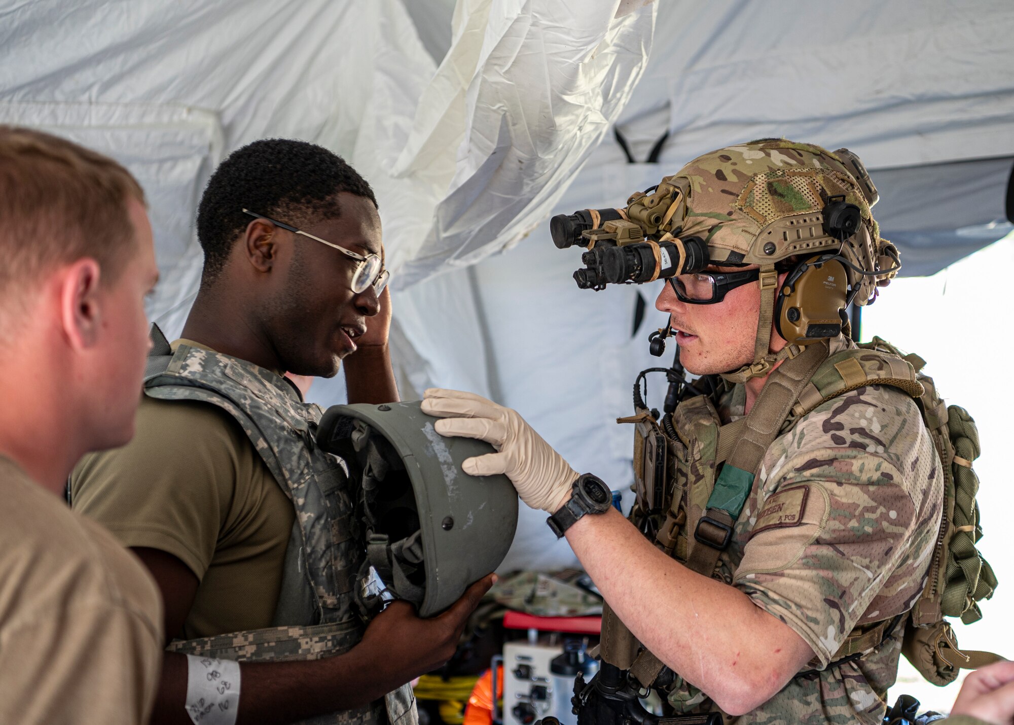 A U.S. Air Force pararescueman assigned to the 38th Rescue Squadron checks on a patient during a simulated mass casualty exercise during Exercise Ready Tiger 24-1 at Avon Park Air Force Range, Florida, April 14, 2024. PJs provide care on the ground as well as in the air fulfilling their motto “so others may live”. Built upon Air Combat Command's directive to assert air power in contested environments, Exercise Ready Tiger 24-1 aims to test and enhance the 23rd Wing’s proficiency in executing Lead Wing and Expeditionary Air Base concepts through Agile Combat Employment and command and control operations. (U.S. Air Force photo by Airman 1st Class Leonid Soubbotine)