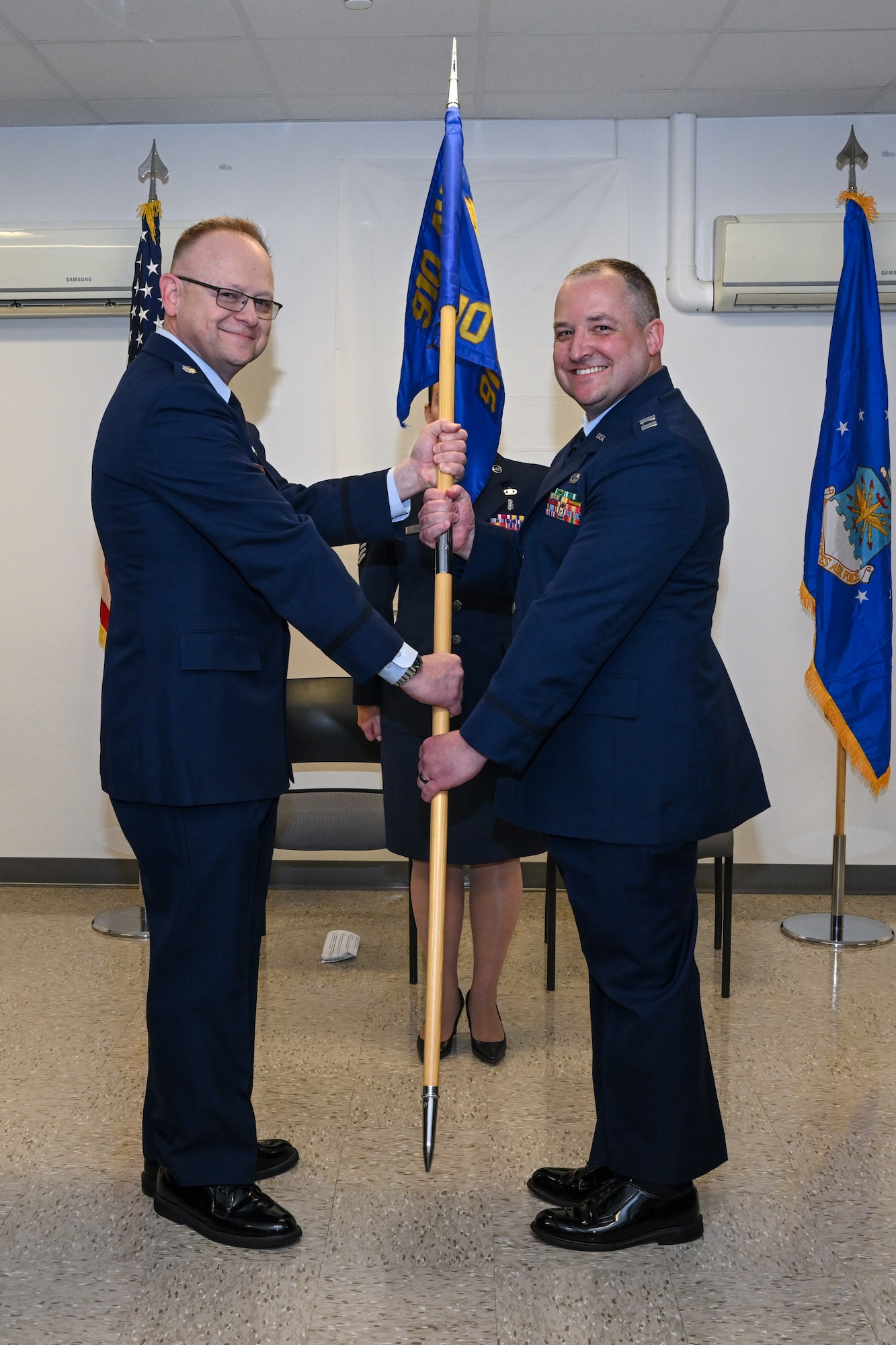 Capt. Jeffrey Kinsey, 910th Logistics Readiness Squadron commander, assumes command from Lt. Col. Russel Whitlock, 910th Mission Support Group commander, during the assumption of command ceremony at Youngstown Air Reserve Station, Ohio, April 6, 2024.