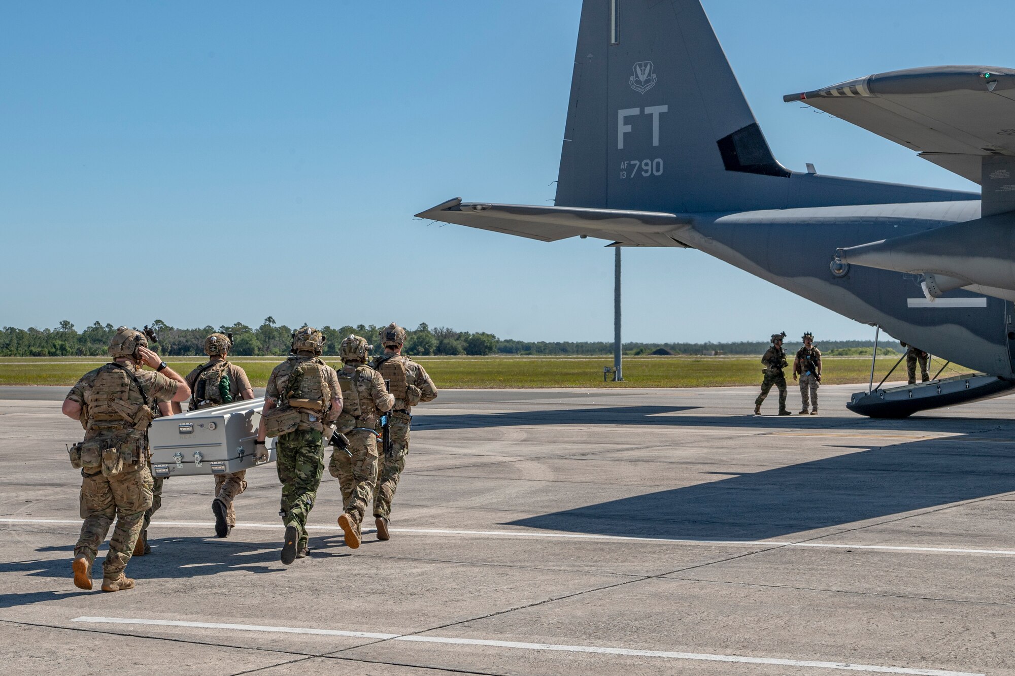 U.S. Air Force Airmen assigned to the 38th Rescue Squadron carry a casket during a simulated mass casualty exercise during Exercise Ready Tiger 24-1 at Avon Park Air Force Range, Florida, April 14, 2024. Pararescue Airmen are highly trained special-warfare operators able to recover personnel and provide aid in any conditions. Built upon Air Combat Command's directive to assert air power in contested environments, Exercise Ready Tiger 24-1 aims to test and enhance the 23rd Wing’s proficiency in executing Lead Wing and Expeditionary Air Base concepts through Agile Combat Employment and command and control operations. (U.S. Air Force photo by Airman 1st Class Leonid Soubbotine)