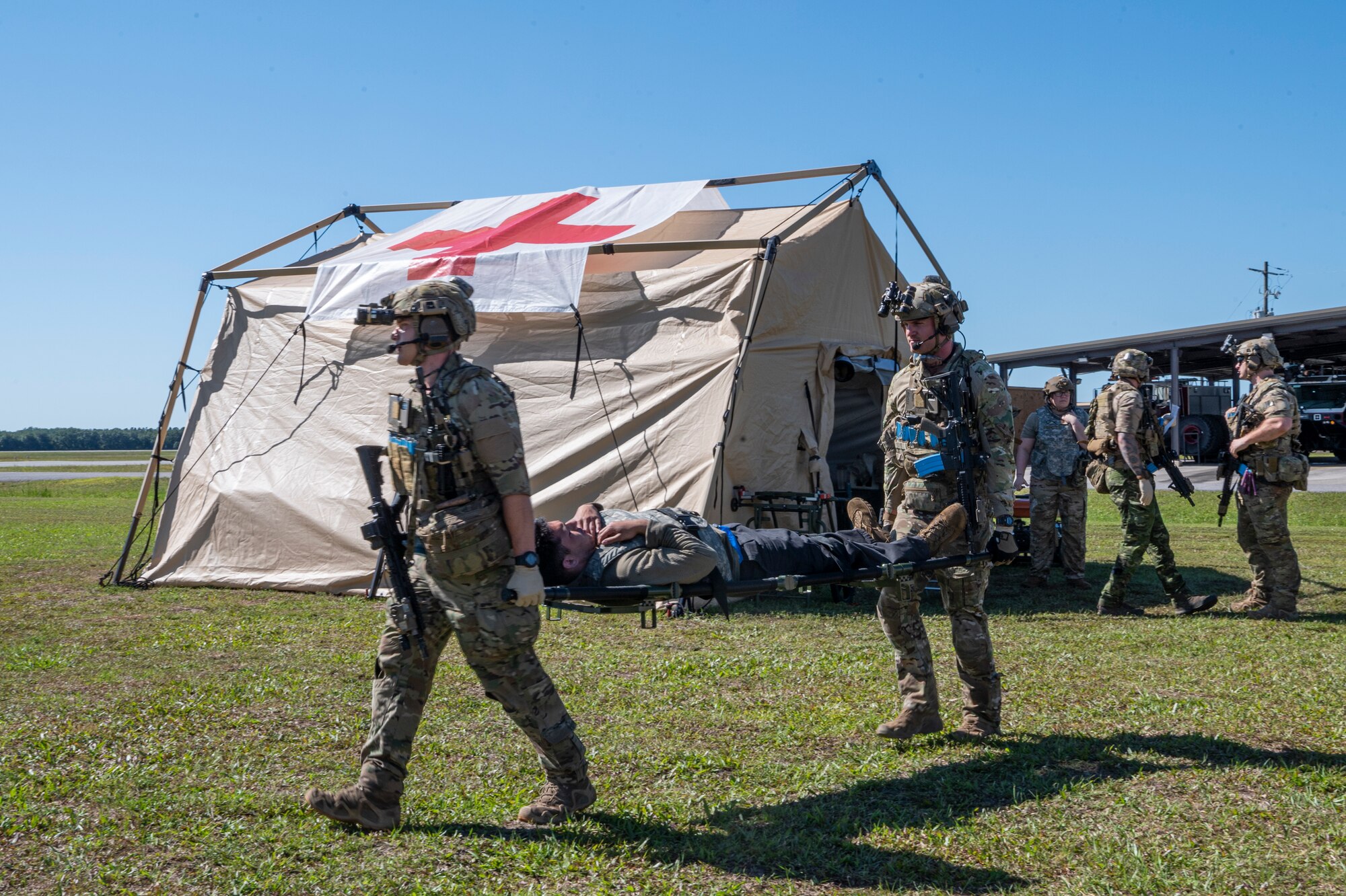 U.S. Air Force Airmen assigned to the 38th Rescue Squadron carry a simulated casualty during Exercise Ready Tiger 24-1 at Avon Park Air Force Range, Florida, April 14, 2024. The mass casualty exercise tested the medical team’s readiness by presenting them with more patients at once than the clinic can immediately handle. Ready Tiger 24-1 is a readiness exercise demonstrating the 23rd Wing’s ability to plan, prepare and execute operations and maintenance to project air power in contested and dispersed locations, defending the United States’ interests and allies. (U.S. Air Force photo by Airman 1st Class Leonid Soubbotine)