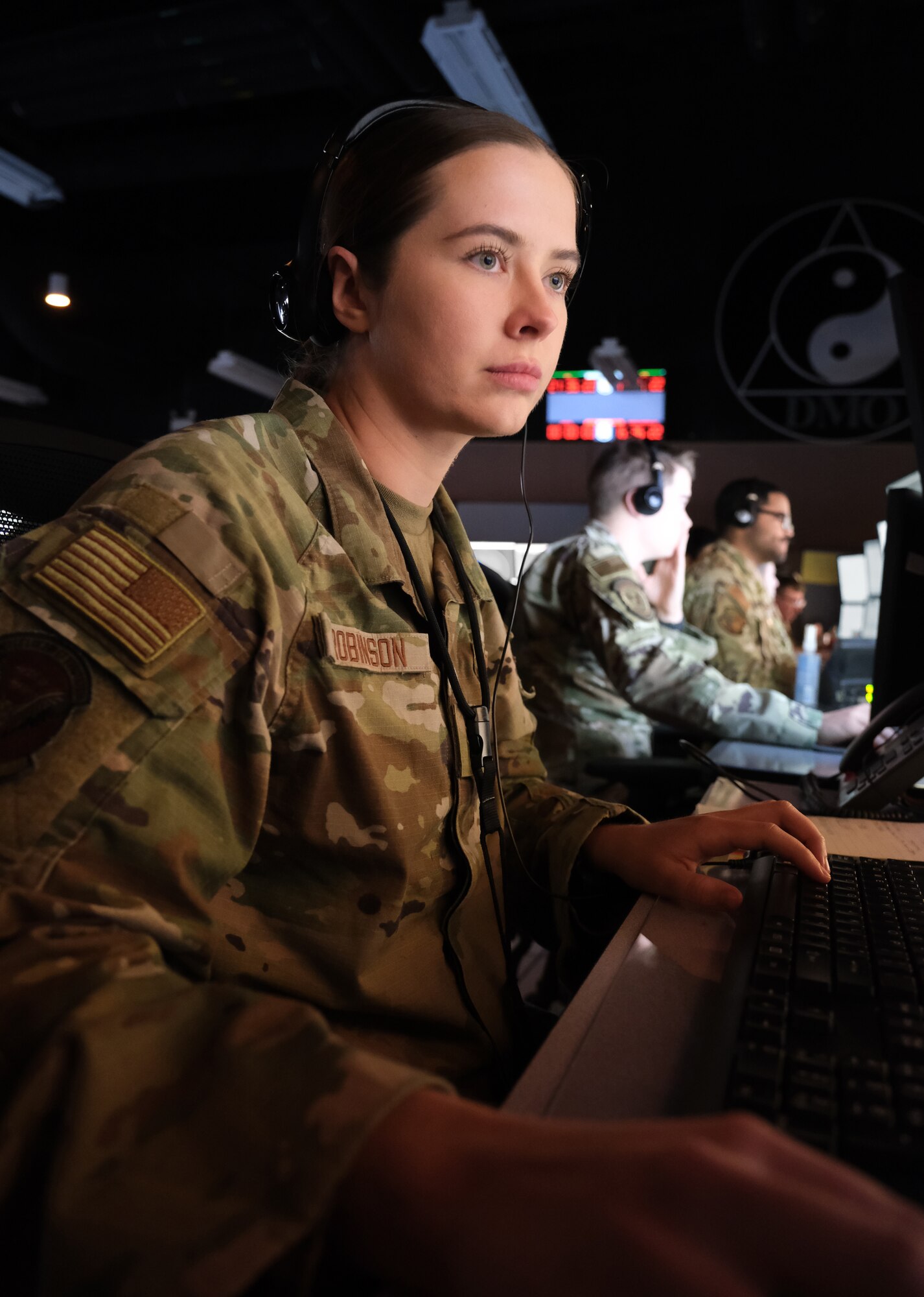 photo of US military personnel working at computers