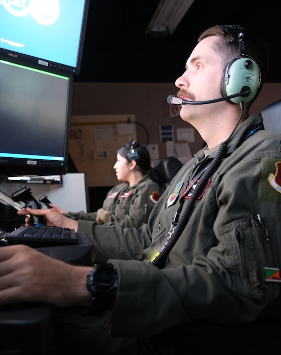 photo of US military personnel flying simulators