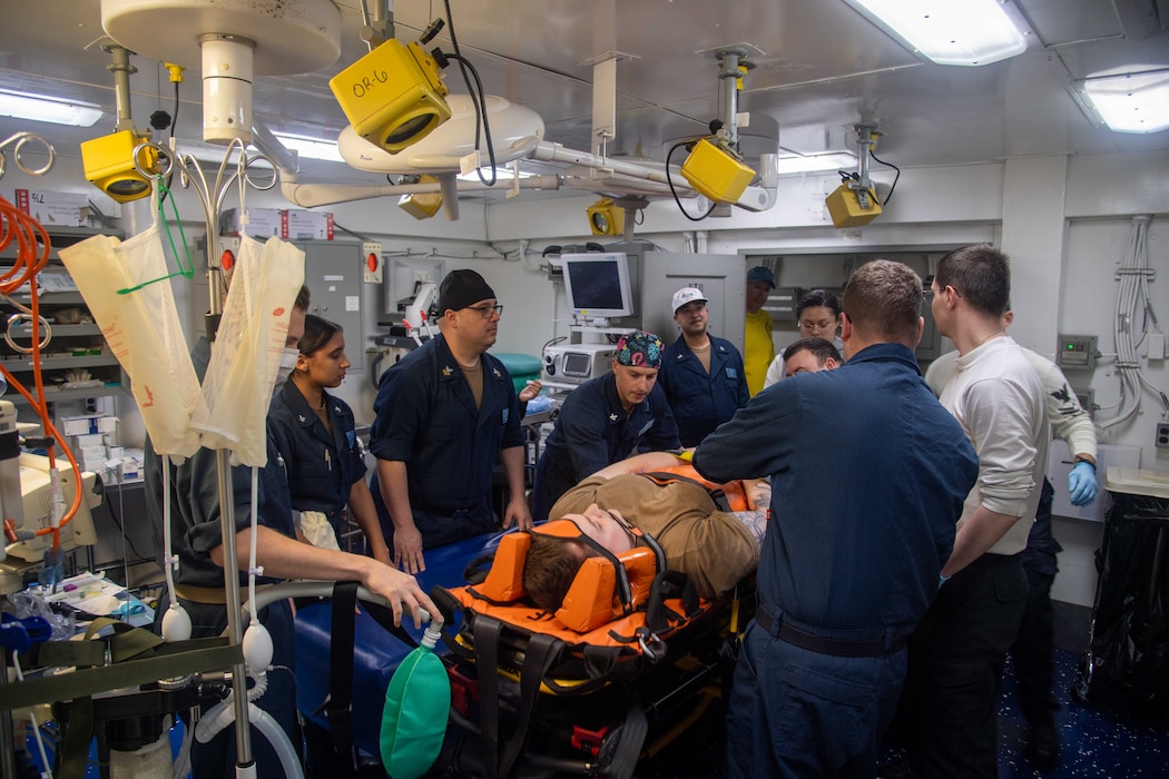 240229-N-SP932-1085 PHILIPPINE SEA (Feb. 29, 2024) U.S. Sailors respond to simulated injuries during a medical mass casualty drill aboard the Nimitz-class aircraft carrier USS Theodore Roosevelt (CVN 71), Feb. 29, 2024. Theodore Roosevelt, flagship of Carrier Strike Group Nine, is underway conducting routine operations in the U.S. 7th Fleet area of operations. U.S. 7th Fleet is the U.S. Navy’s largest forward-deployed numbered fleet, and routinely interacts and operates with allies and partners in preserving a free and open Indo-Pacific region. (U.S. Navy photo by Mass Communication Specialist 2nd Class Krescent Peters)