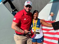 Ross Alewine congratulates Team US athlete Retired Army Cpl. Tiffanie Johnson on her gold medal win at Invictus Games in Dusseldorf, Germany.